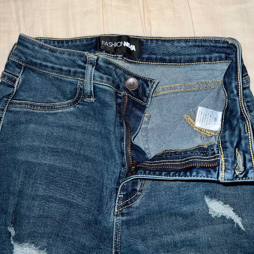 booty sculpting ripped high-rise stretch, skinny jeans in dark wash.